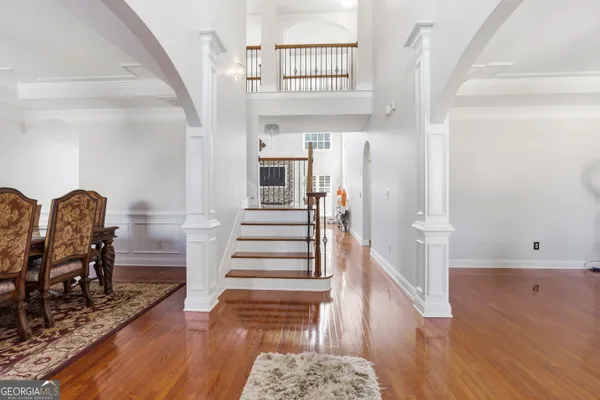 a view of a dining room with furniture and chandelier