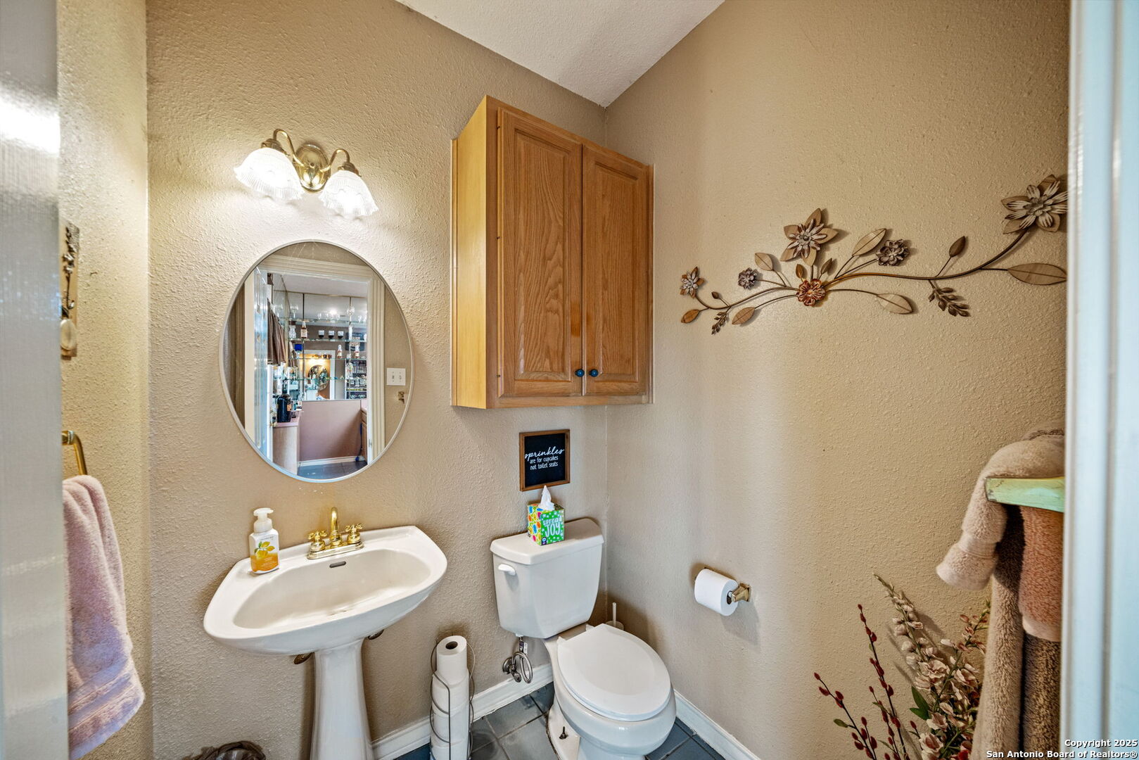 210 Tolle Road Cibolo, TX 78108 - Photo 14 of 61 a bathroom with a toilet sink and mirror