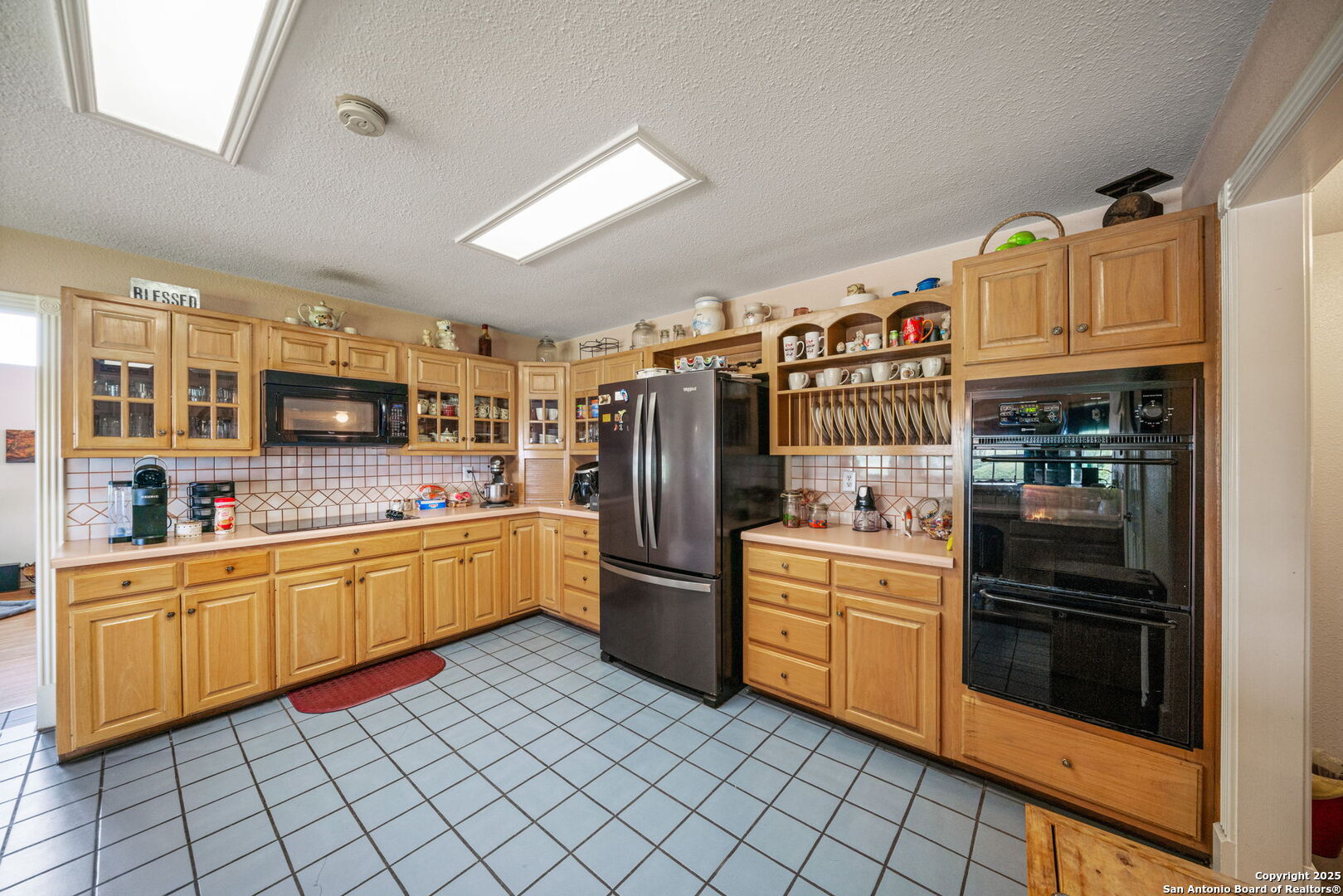 210 Tolle Road Cibolo, TX 78108 - Photo 16 of 61 a kitchen with stainless steel appliances granite countertop a refrigerator and a stove top oven