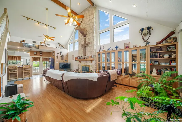 a living room with furniture a rug and white walls