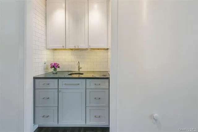 a view of cabinets and wooden floor