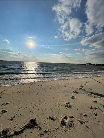 a view of beach and an ocean