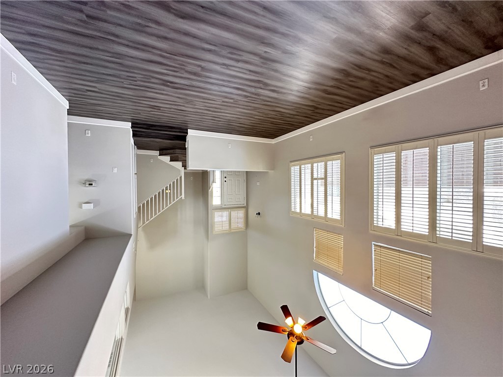 10191 Splendor Ridge Avenue Las Vegas, NV 89135 - Photo 7 of 31 High ceilings and a grand staircase create an airy, luminous main living space.