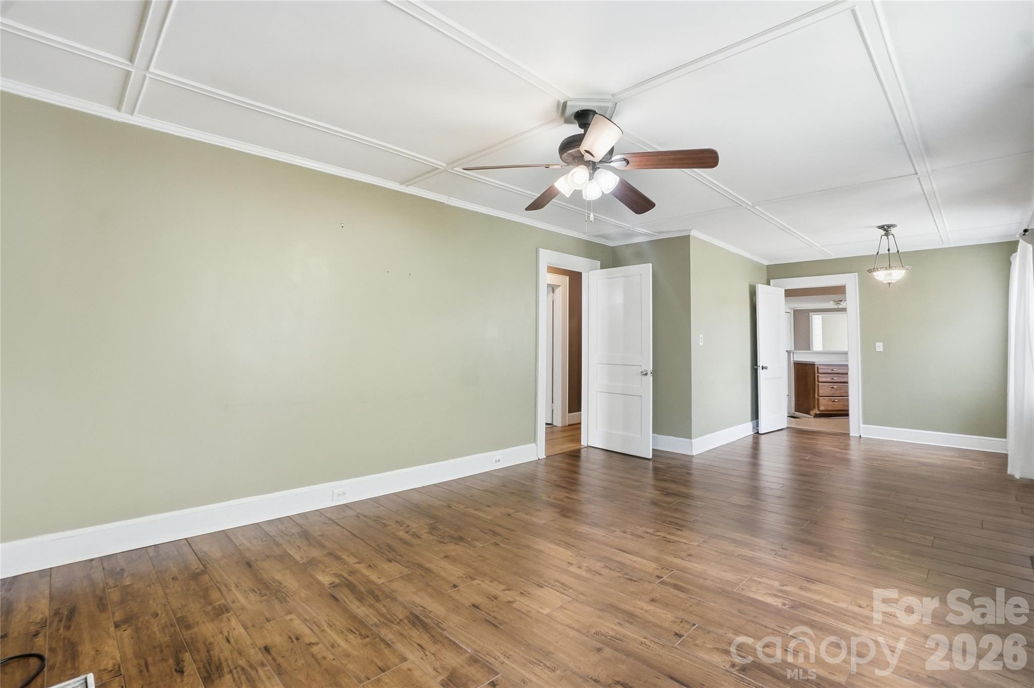 208 Jackson Terrace Clover, SC 29710 - Photo 13 of 30 a view of an empty room with window and wooden floor