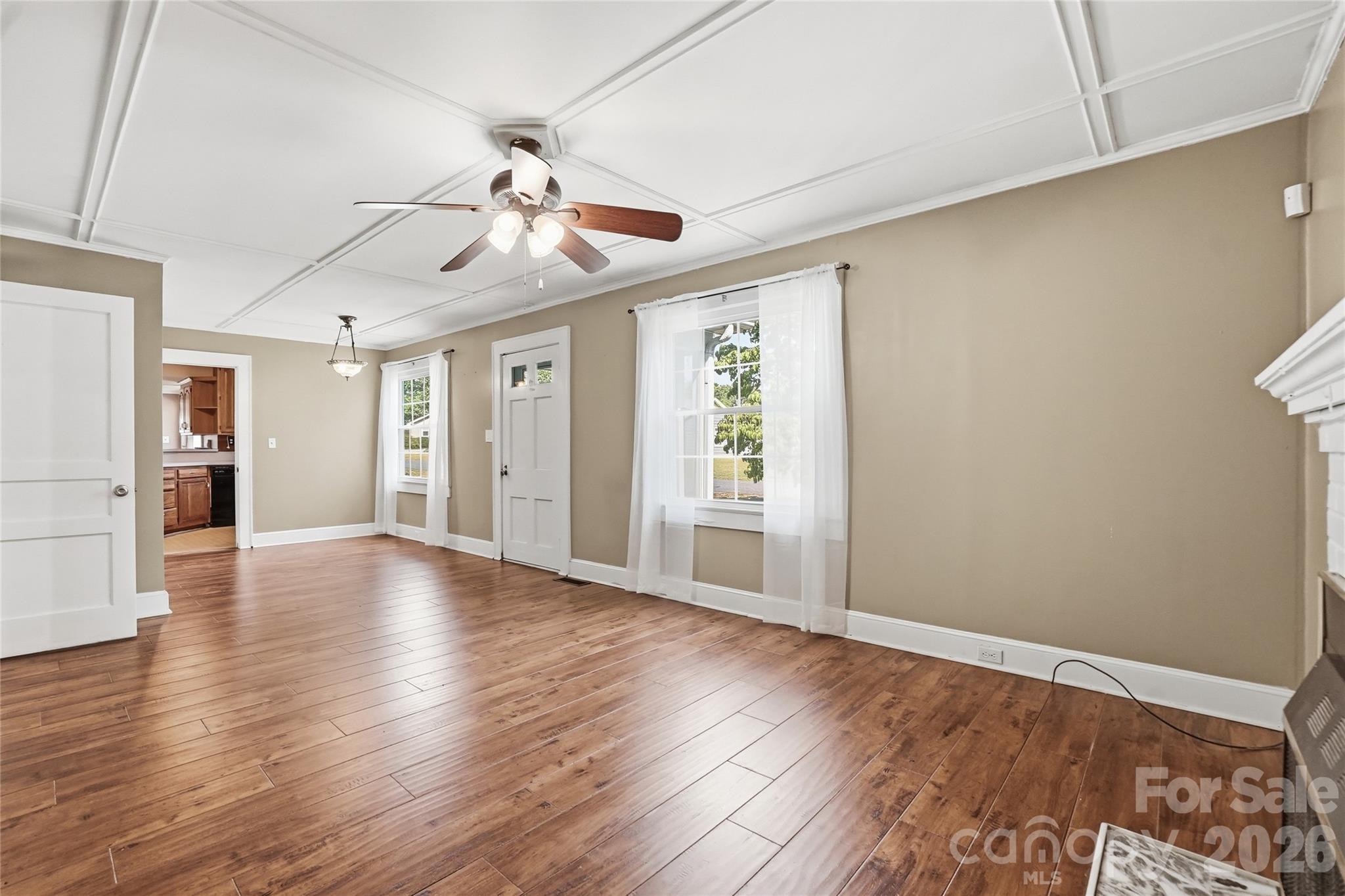 208 Jackson Terrace Clover, SC 29710 - Photo 14 of 30 a view of an empty room with wooden floor and a window