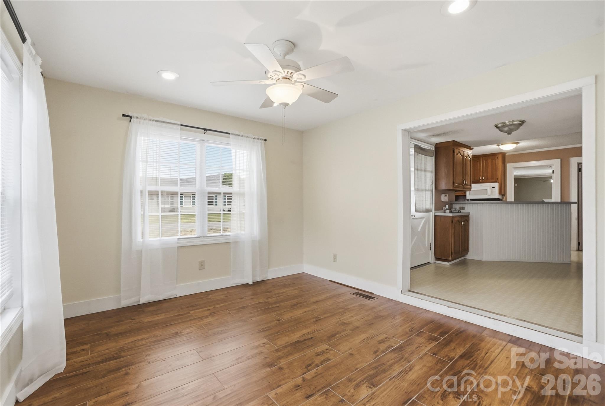 208 Jackson Terrace Clover, SC 29710 - Photo 17 of 30 wooden floor in an empty room with a window