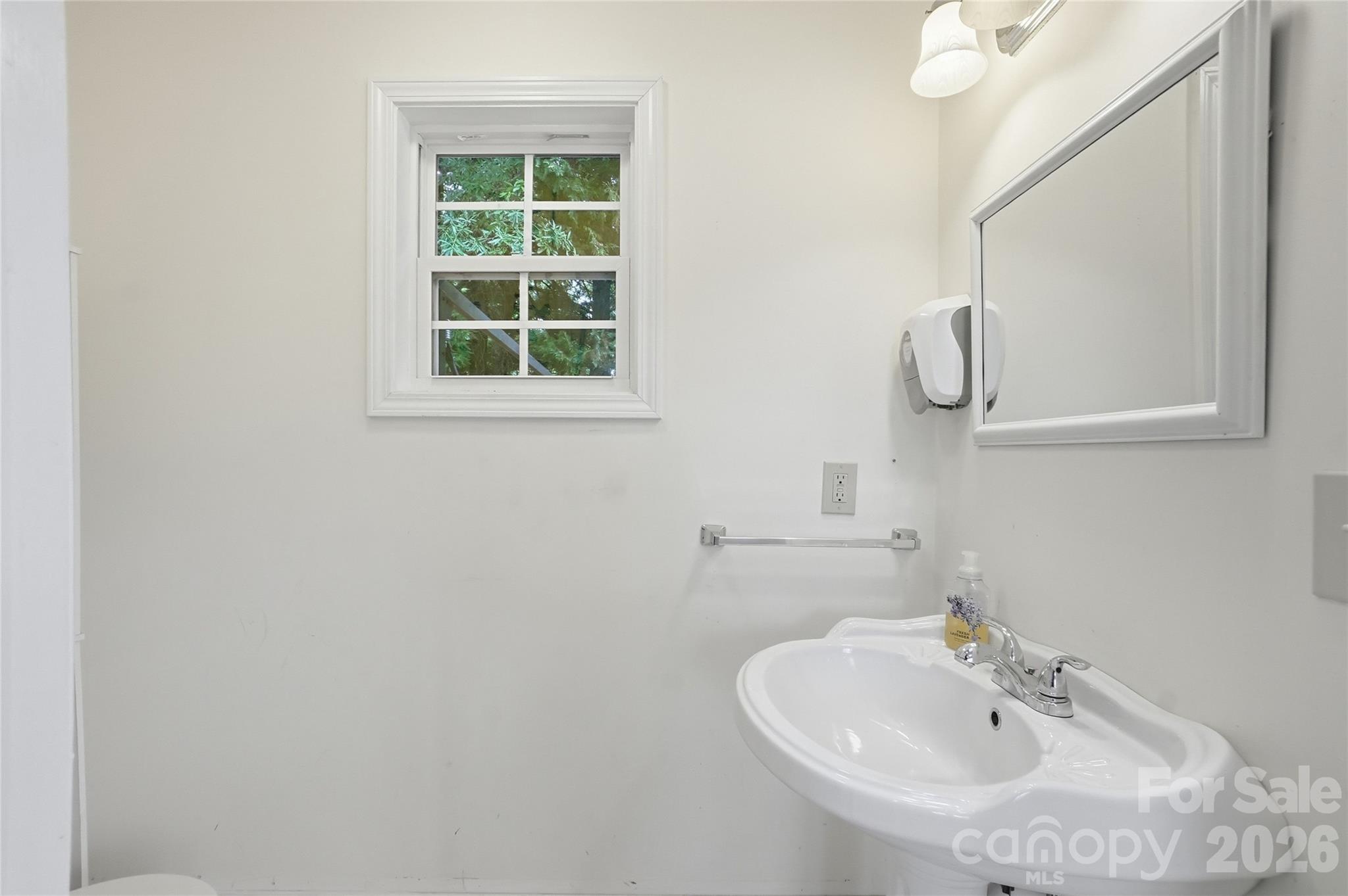 208 Jackson Terrace Clover, SC 29710 - Photo 18 of 30 a bathroom with a sink and a window