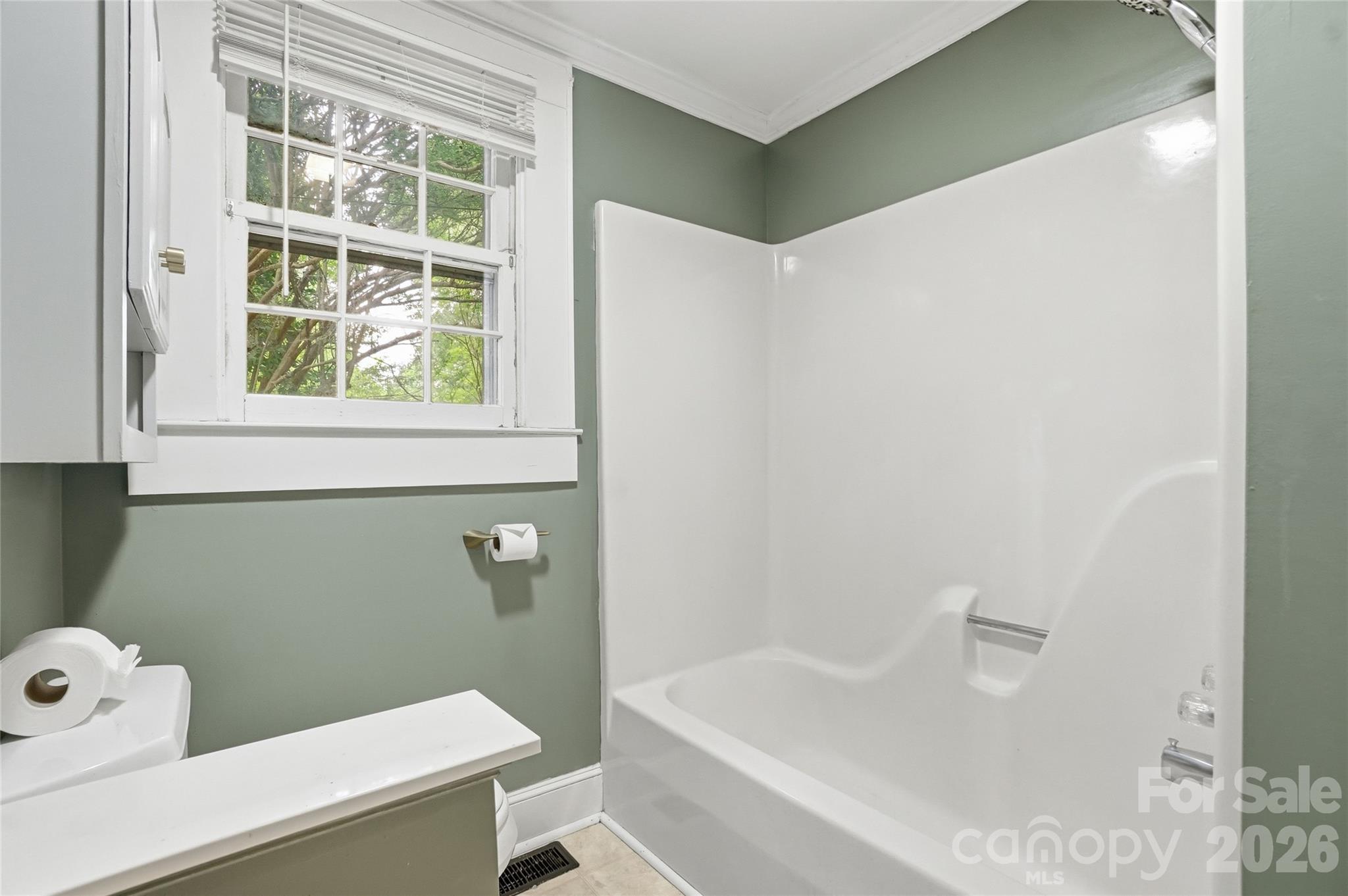 208 Jackson Terrace Clover, SC 29710 - Photo 23 of 30 a bathroom with a bathtub and window