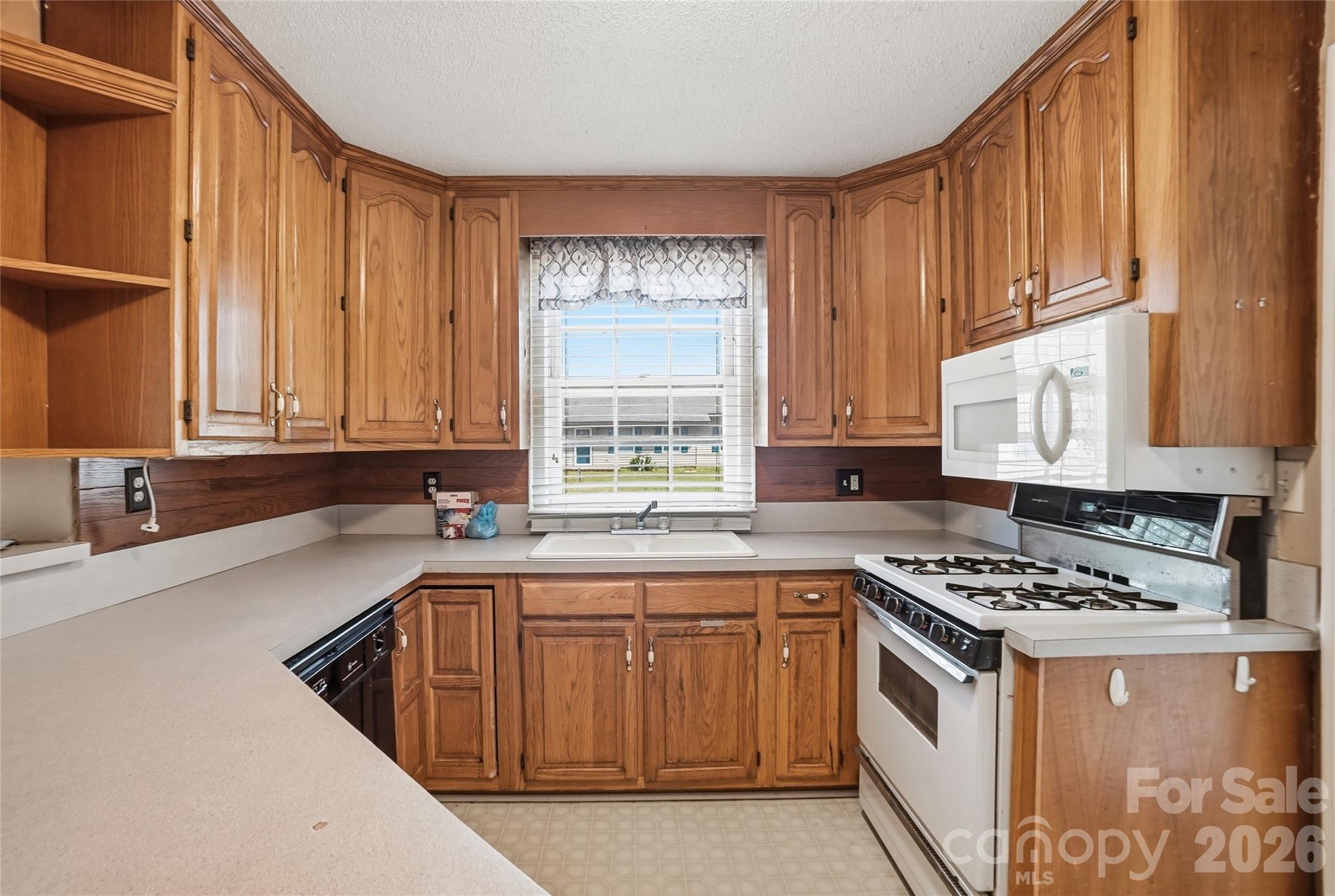 208 Jackson Terrace Clover, SC 29710 - Photo 6 of 30 a kitchen with stainless steel appliances granite countertop a sink a stove and cabinets