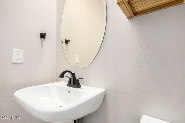 a kitchen with stainless steel appliances a stove a sink a microwave and cabinets