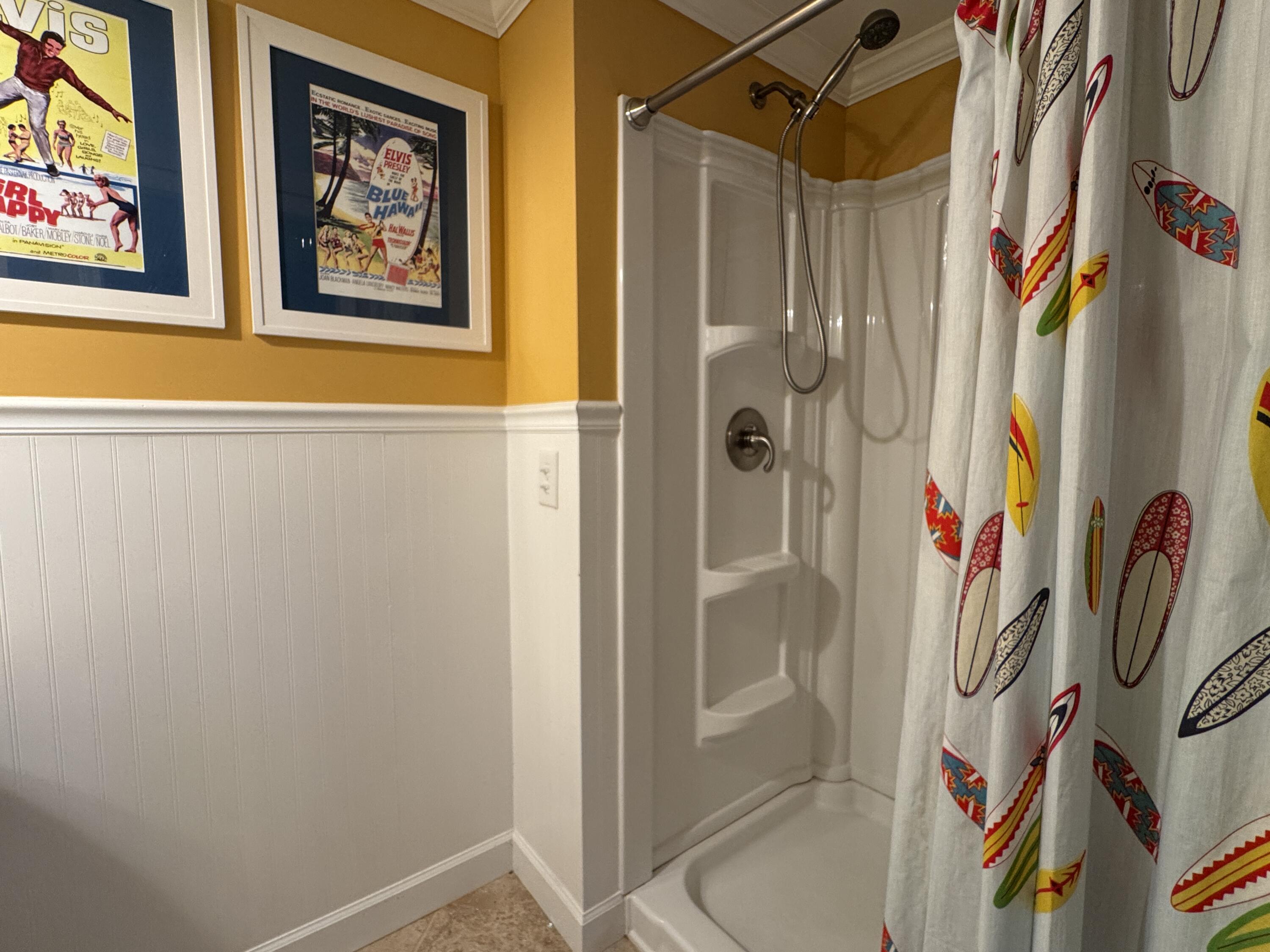17614 Front Beach Road, Unit C13 Panama City Beach, FL 32413 - Photo 12 of 16 a bathroom with a shower curtain
