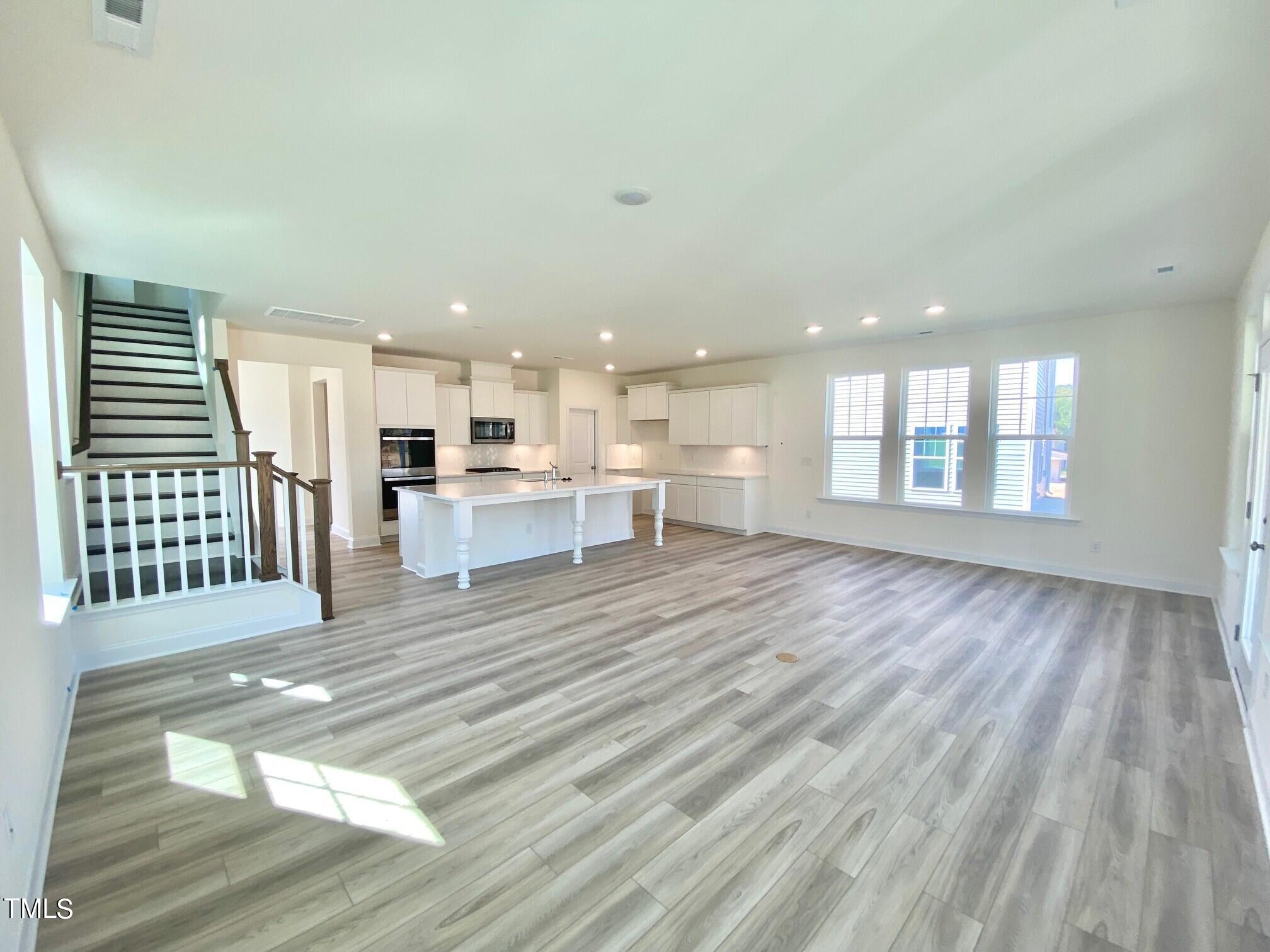 79 Flowing River Road, Unit 39 Angier, NC 27501 - Photo 6 of 26 LVP Entire 1st Floor