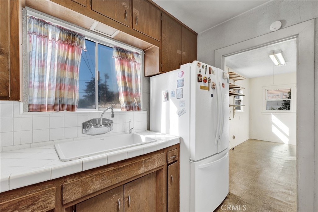 637 East Fairmount Road Burbank, CA 91501 - Photo 19 of 25 a kitchen with stainless steel appliances a refrigerator sink and cabinets