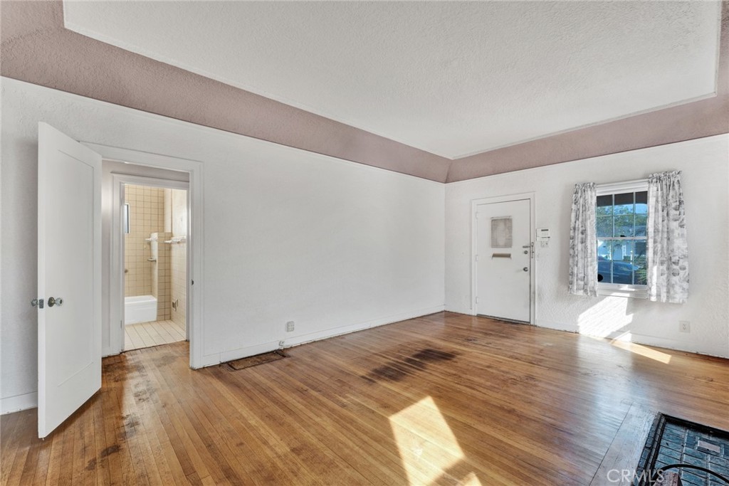637 East Fairmount Road Burbank, CA 91501 - Photo 9 of 25 a view of a livingroom with wooden floor and a bathroom