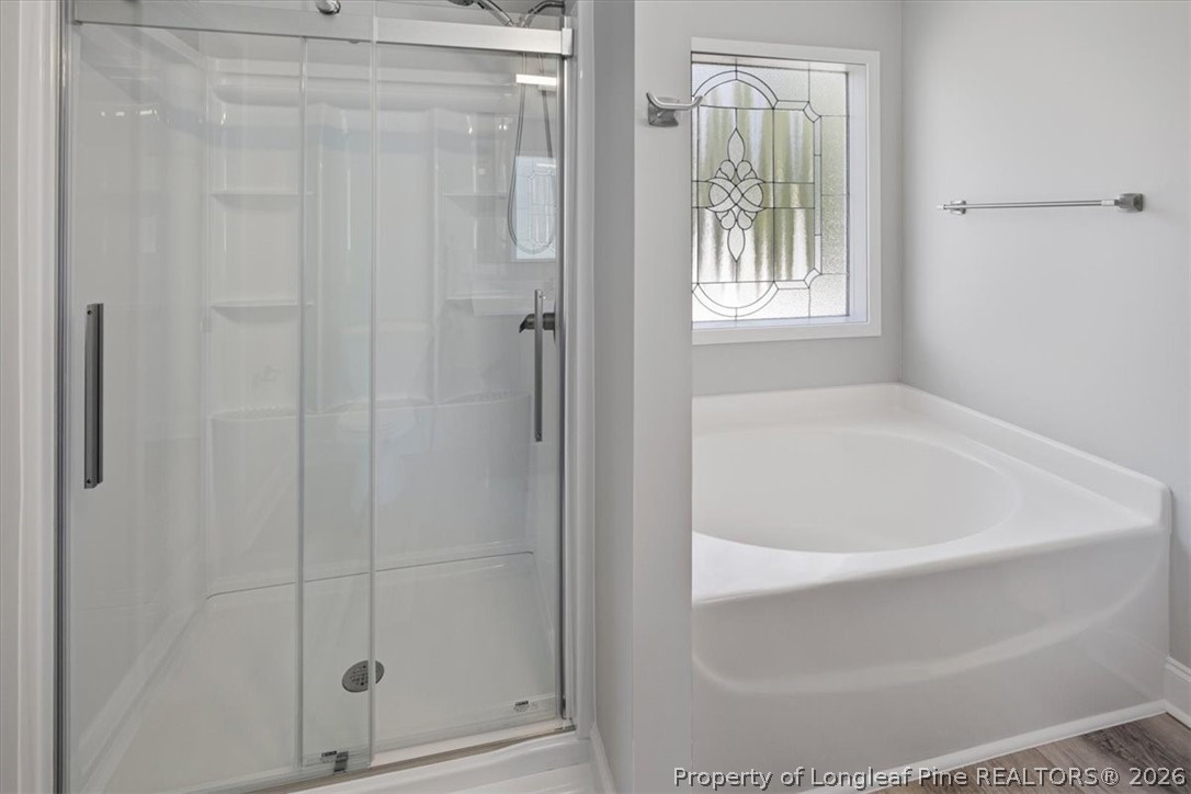 134 Huzzas Circle Cameron, NC 28326 - Photo 20 of 31 a white bath tub sitting next to a shower