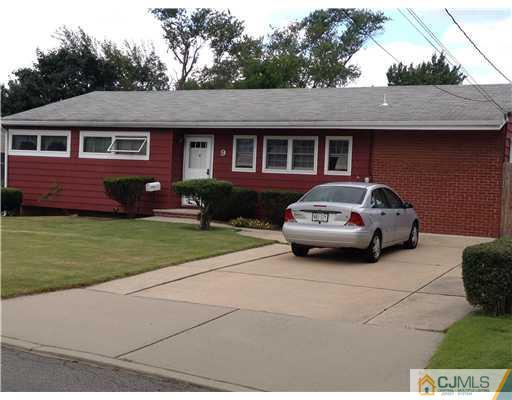 9 Clemson Road Old Bridge, NJ 08859 - Photo 2 of 10 a car parked in front of a house