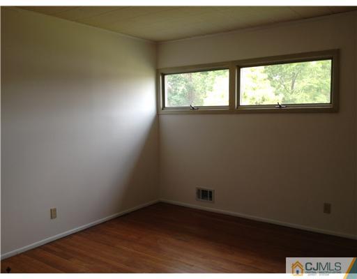 9 Clemson Road Old Bridge, NJ 08859 - Photo 6 of 10 an empty room with a window