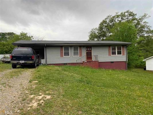 119 Robin Hood Road Northeast Rome, GA 30161 - Photo 1 of 1 a front view of house with yard and trees
