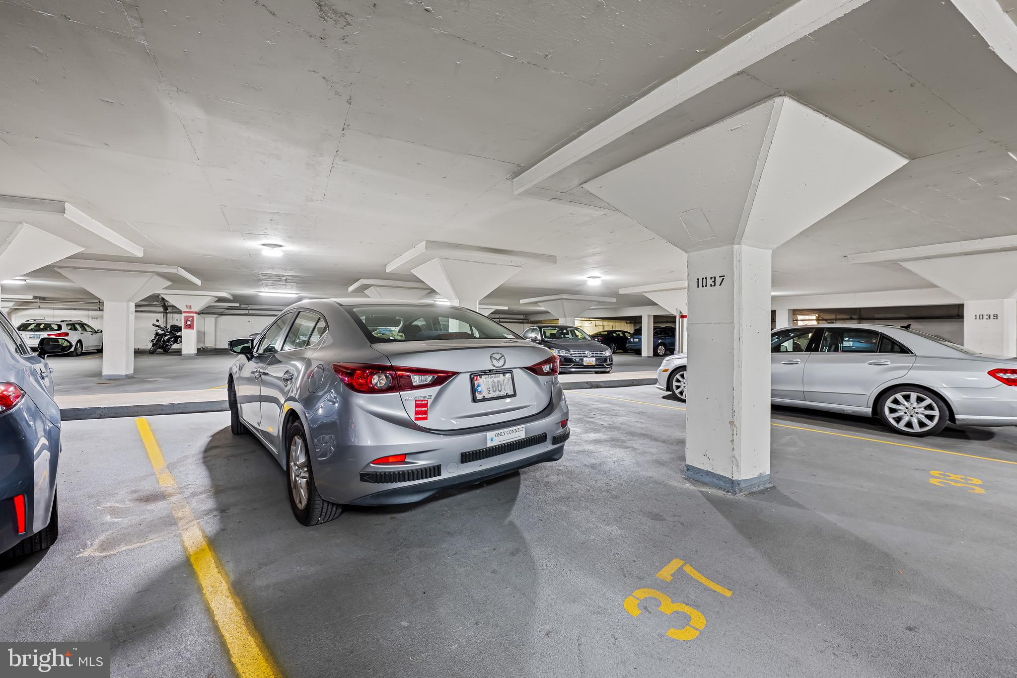 3601 Greenway, Unit 705 Baltimore, MD 21218 - Photo 27 of 30 a view of parking garage with cars parked