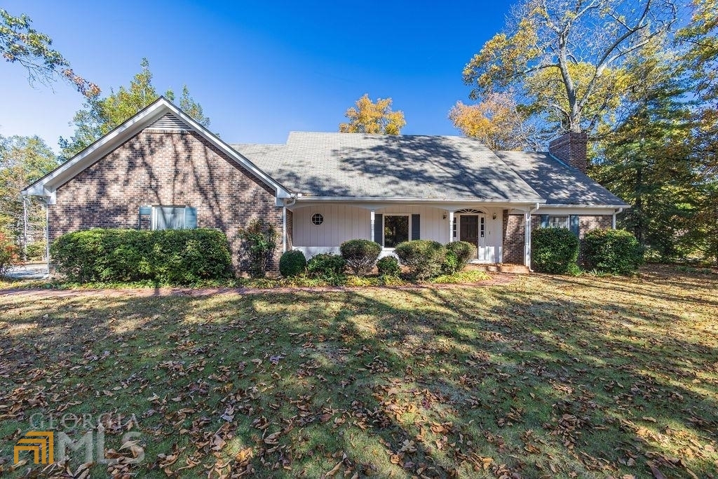 7960 Fayetteville Road Fairburn, GA 30213 - Photo 1 of 1 a view of a house with backyard and sitting area