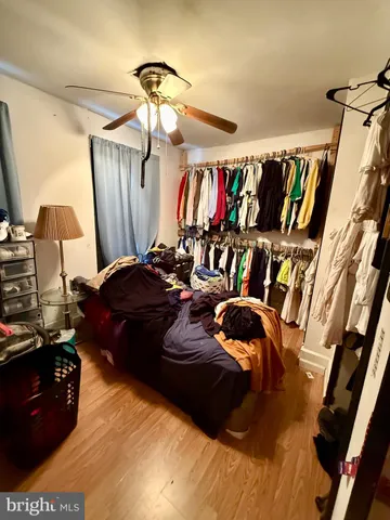 a bedroom with a bed and a walk in closet
