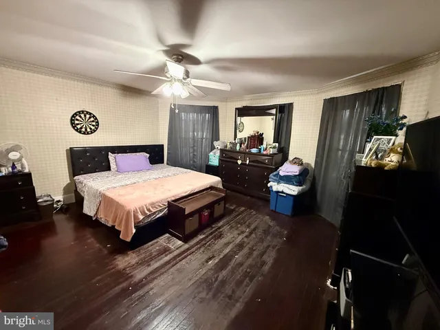 a bedroom with a bed and dresser