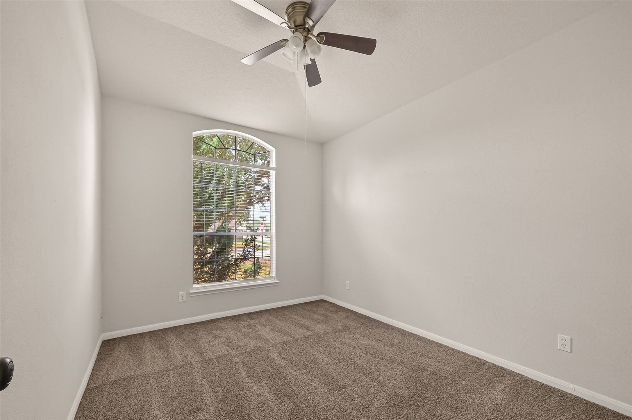 1918 Riane Lane Houston, TX 77049 - Photo 20 of 35 an empty room with windows and fan