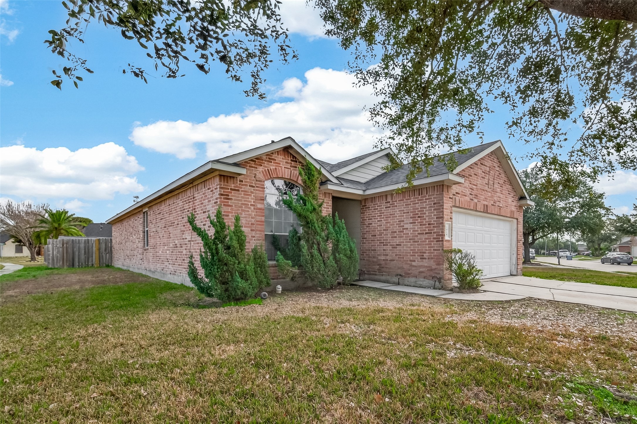 1918 Riane Lane Houston, TX 77049 - Photo 2 of 35 a view of a house with a yard and large tree