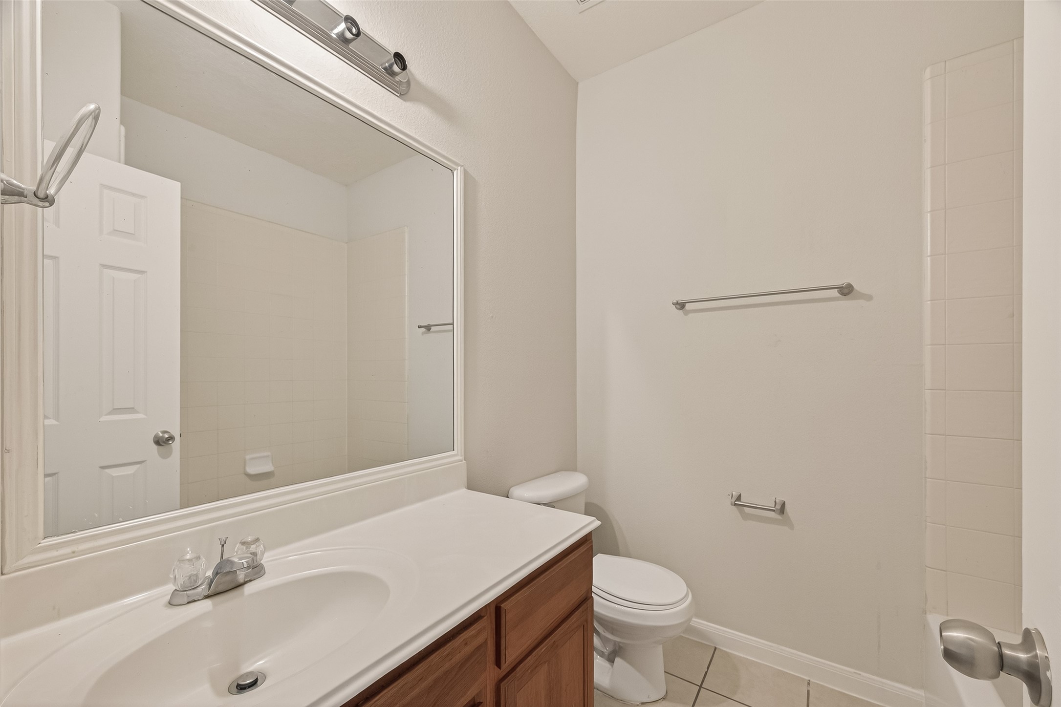 1918 Riane Lane Houston, TX 77049 - Photo 21 of 35 a bathroom with a sink toilet and vanity