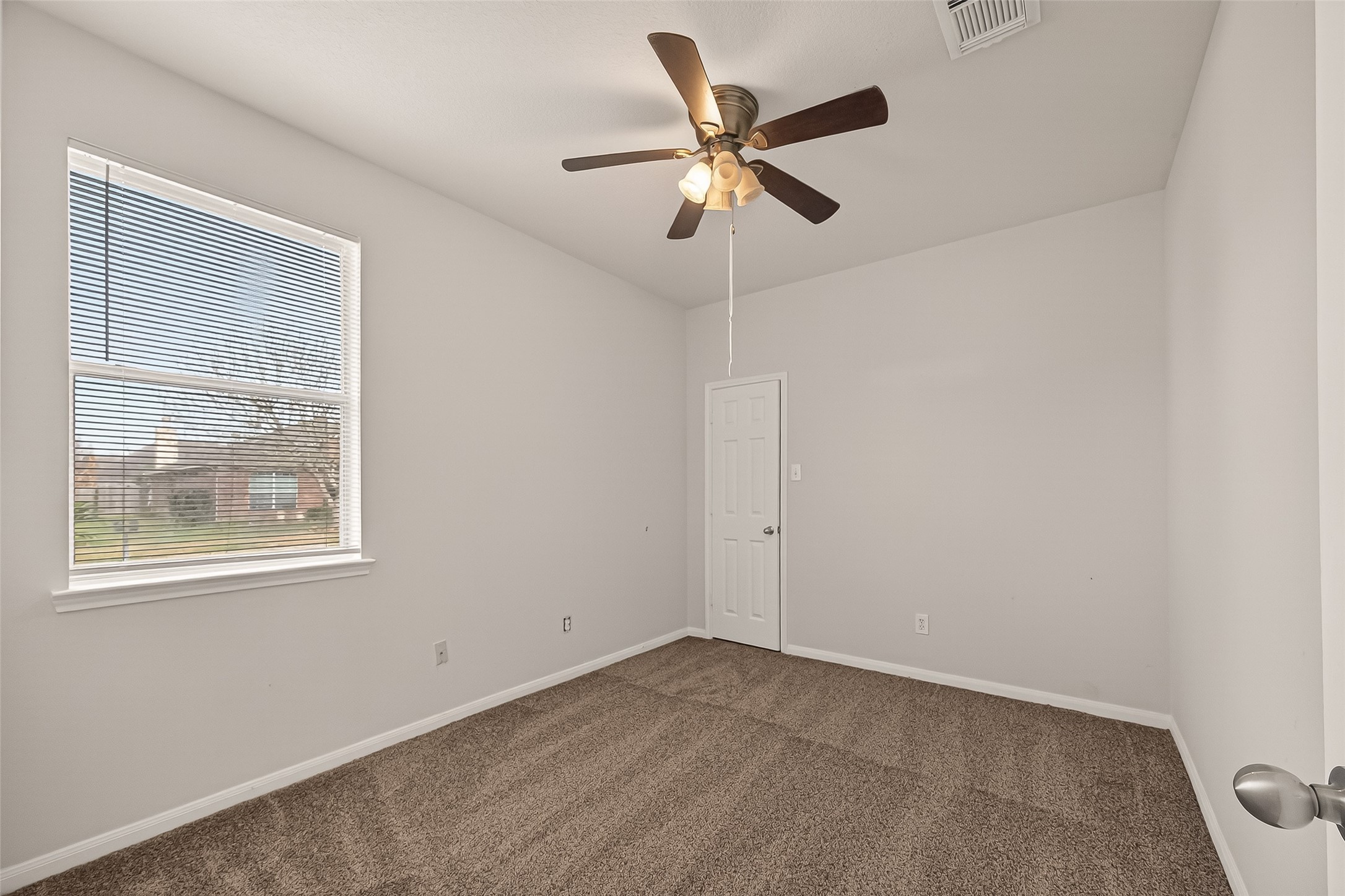 1918 Riane Lane Houston, TX 77049 - Photo 23 of 35 a view of an empty room with a window