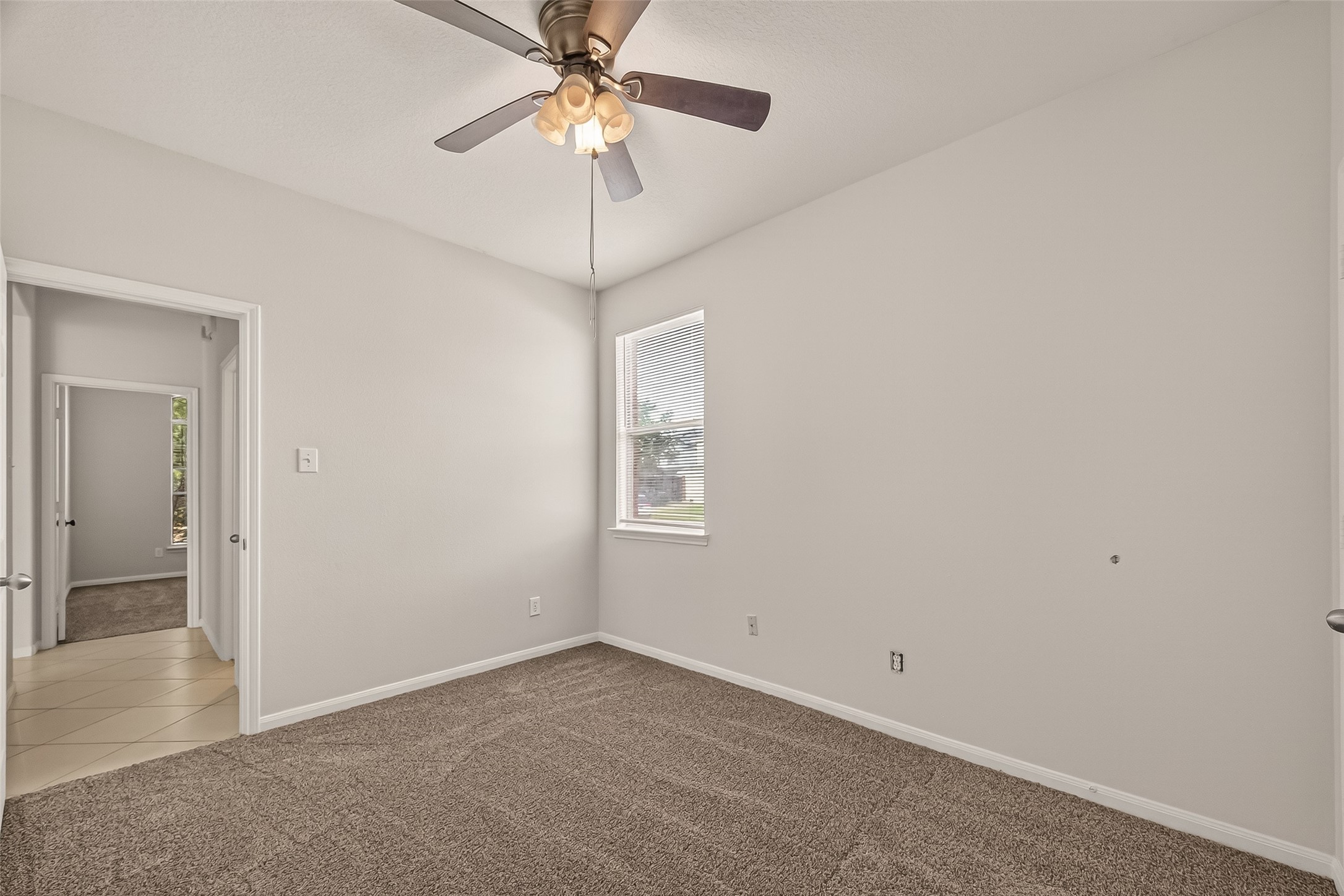 1918 Riane Lane Houston, TX 77049 - Photo 24 of 35 wooden floor in an empty room with a window