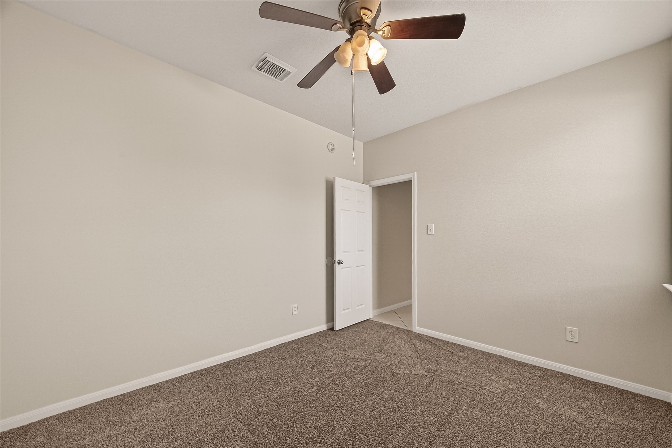 1918 Riane Lane Houston, TX 77049 - Photo 25 of 35 an empty room with closet and a chandelier fan