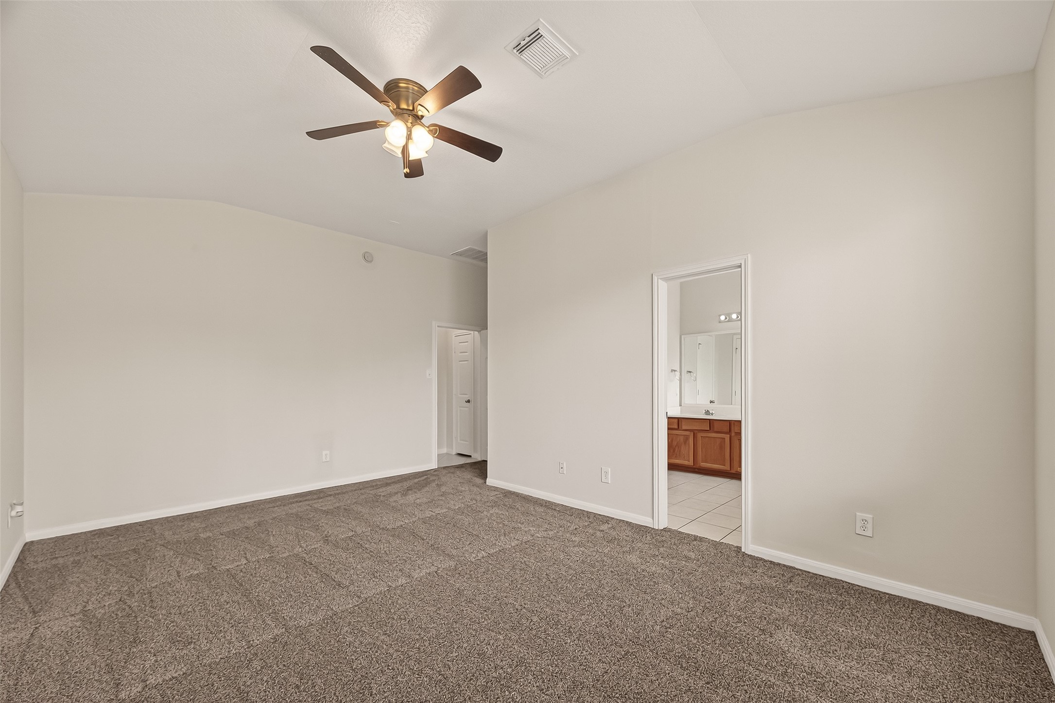 1918 Riane Lane Houston, TX 77049 - Photo 28 of 35 an empty room with closet and ceiling fan