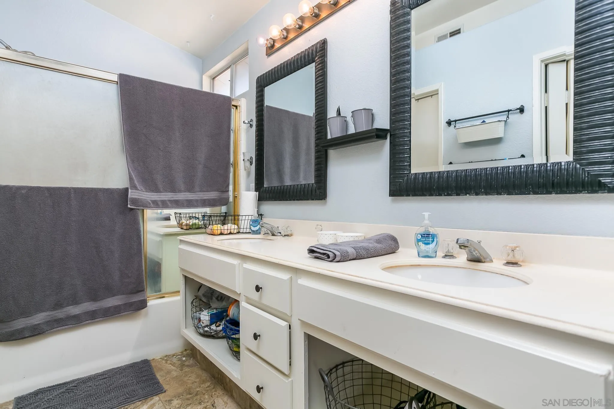310 Cobblestone Place Santee, CA 92071 - Photo 17 of 32 a bathroom with a sink and a mirror