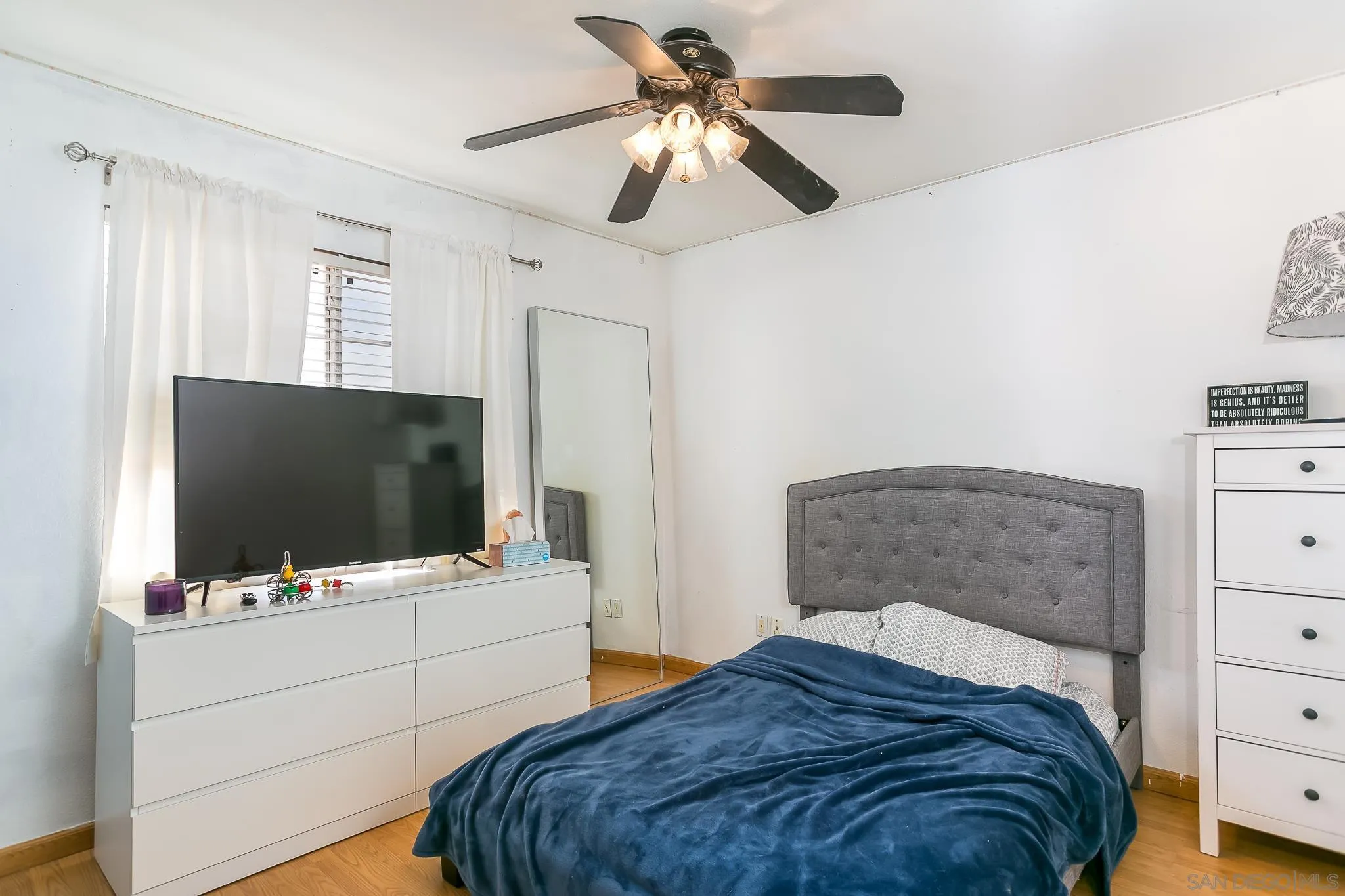 310 Cobblestone Place Santee, CA 92071 - Photo 21 of 32 a bedroom with a bed and a flat tv screen on dresser