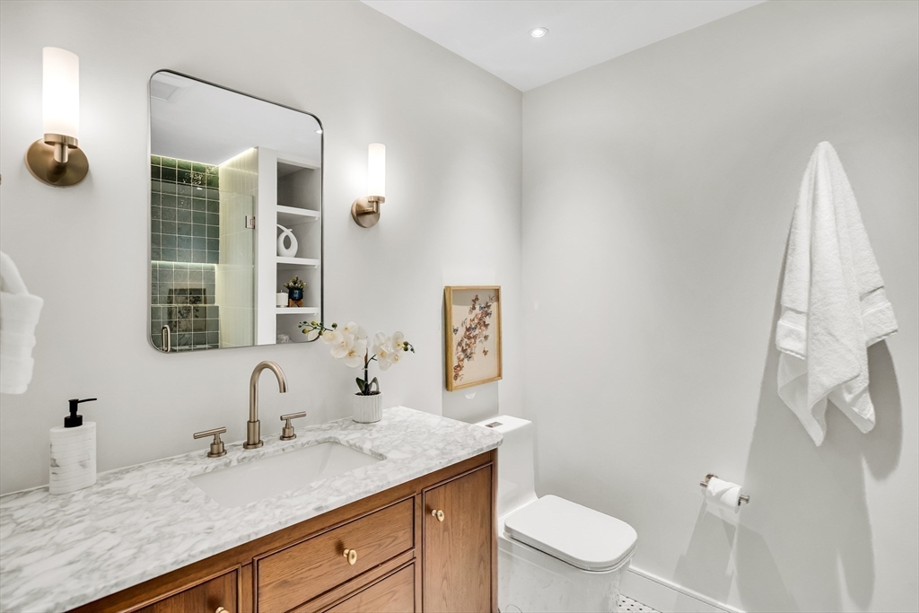 70 Birch Hill Road Belmont, MA 02478 - Photo 18 of 41 a bathroom with a granite countertop sink and a mirror