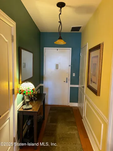 a dining room with furniture and chandelier