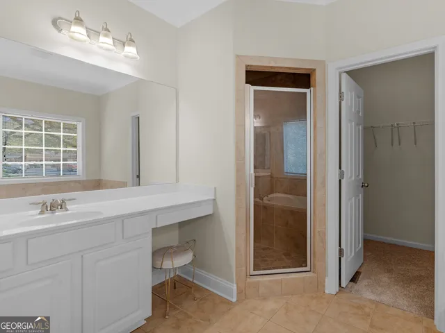 a bathroom with a bathtub and a sink