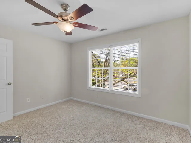 an empty room with a empty space and windows