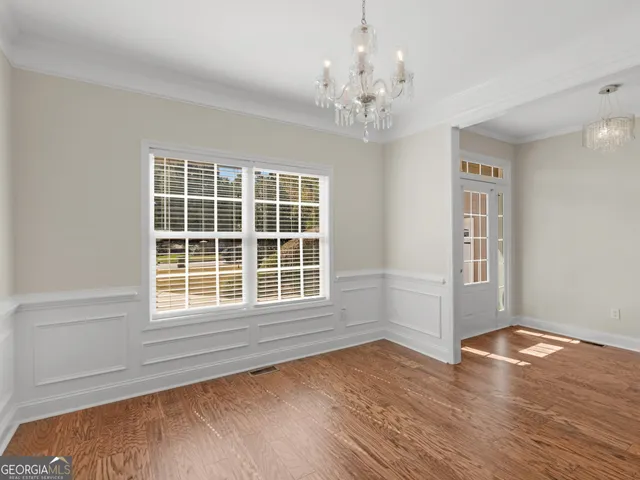 a kitchen with stainless steel appliances granite countertop a refrigerator and cabinets