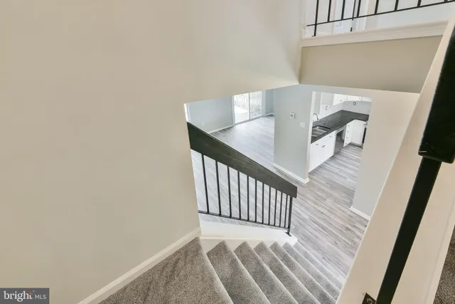 a view of a hallway with a wooden floor
