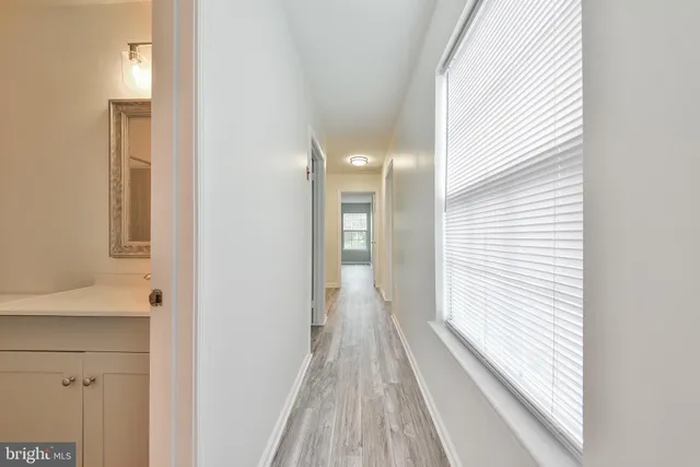 a view of gallery with wooden floor
