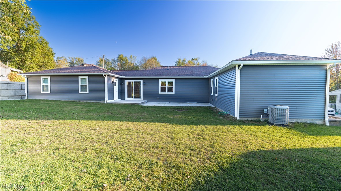 6264 Herbert Road Canfield, OH 44406 - Photo 38 of 47 Back of property featuring a patio area and a lawn