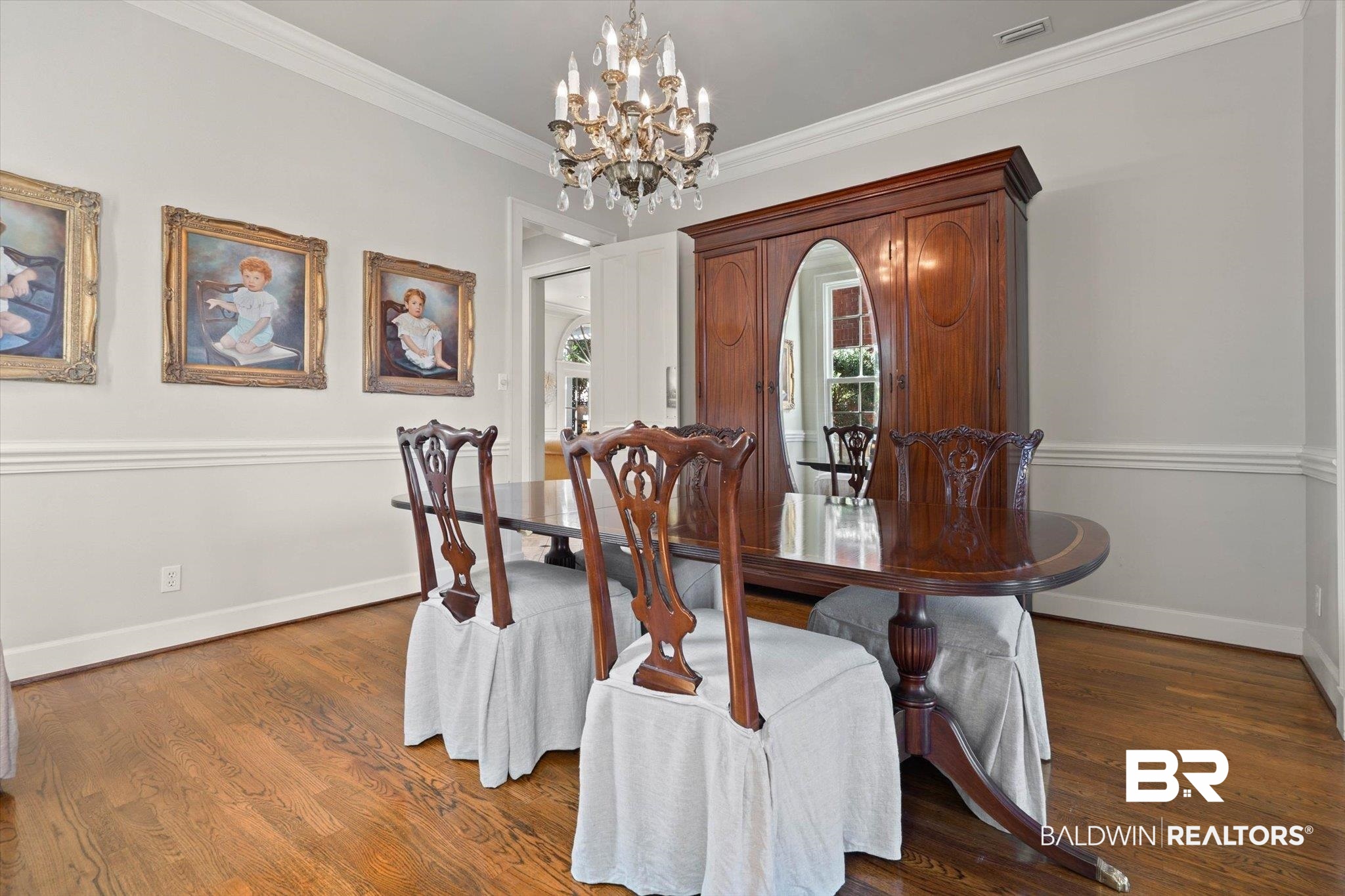 3615 Stein Street Mobile, AL 36608 - Photo 9 of 44 Dining space with a chandelier, dark wood-style floors, and crown molding