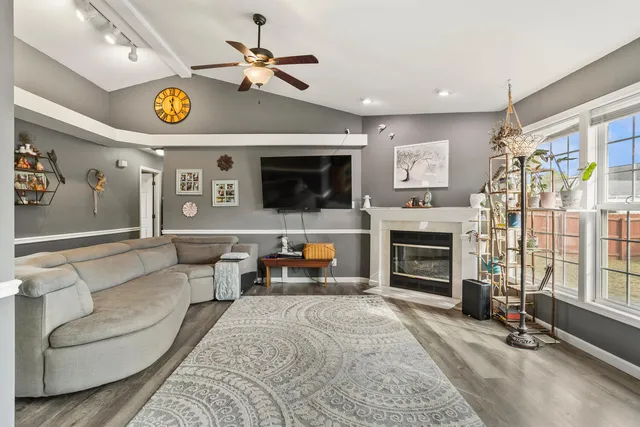 a living room with furniture and a fireplace