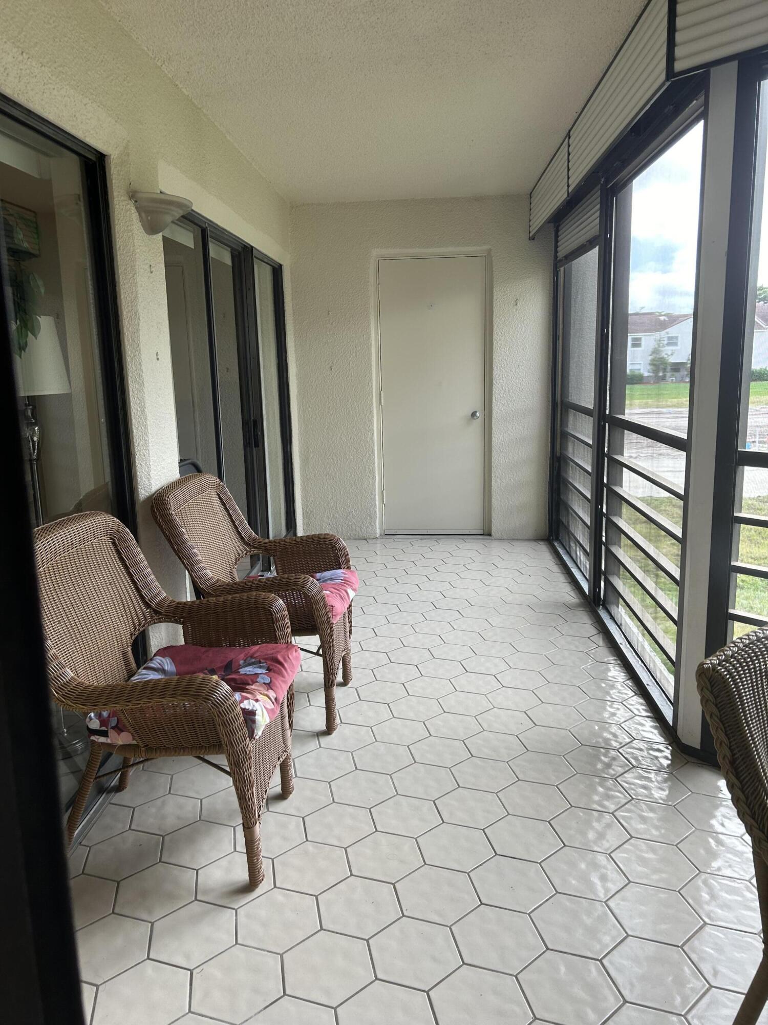 5701 Camino Del Sol, Unit 204 Boca Raton, FL 33433 - Photo 5 of 17 PATIO W/FURNITURE