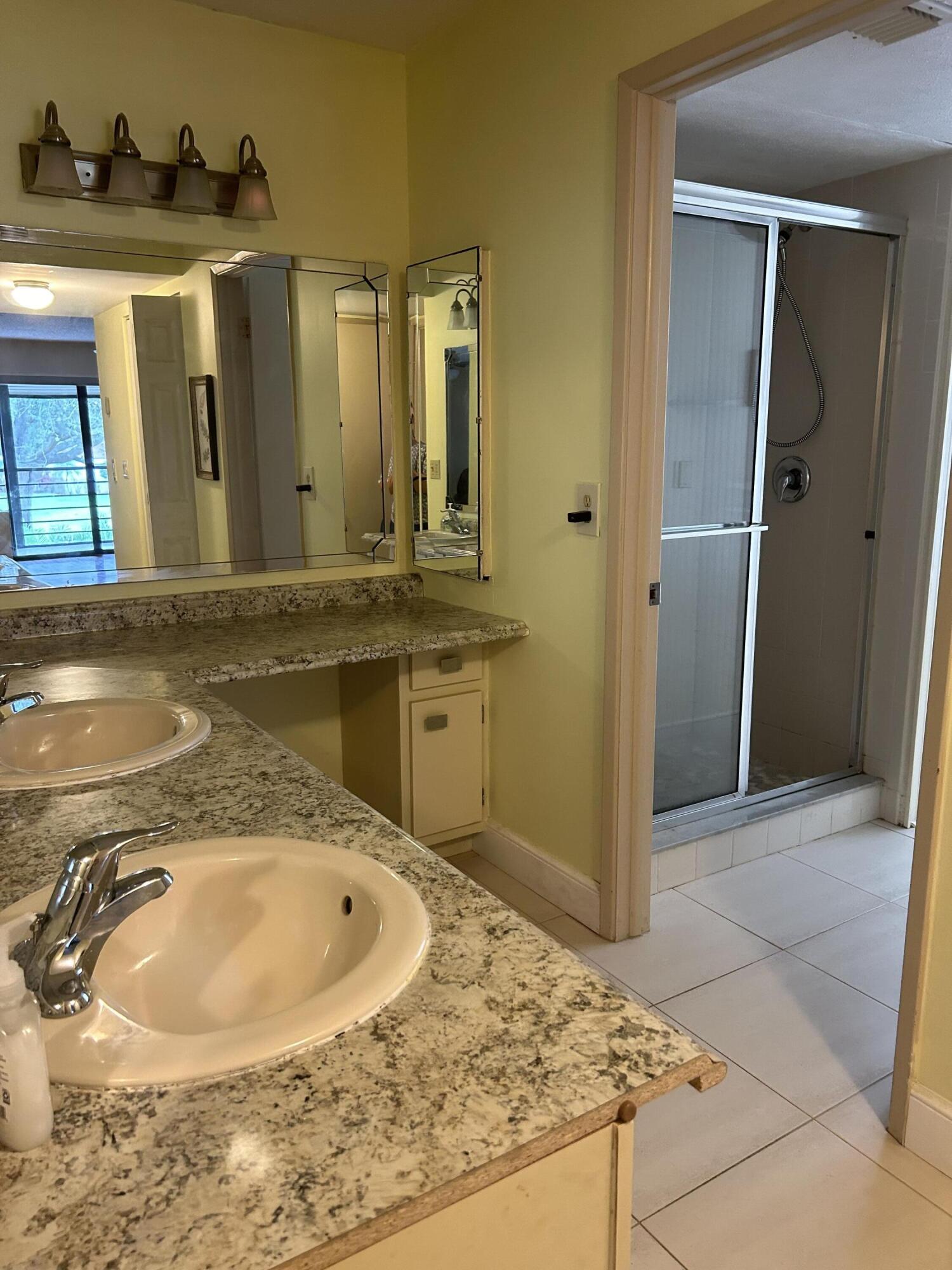 5701 Camino Del Sol, Unit 204 Boca Raton, FL 33433 - Photo 7 of 17 MASTER BATHROOM, 2 SINKS