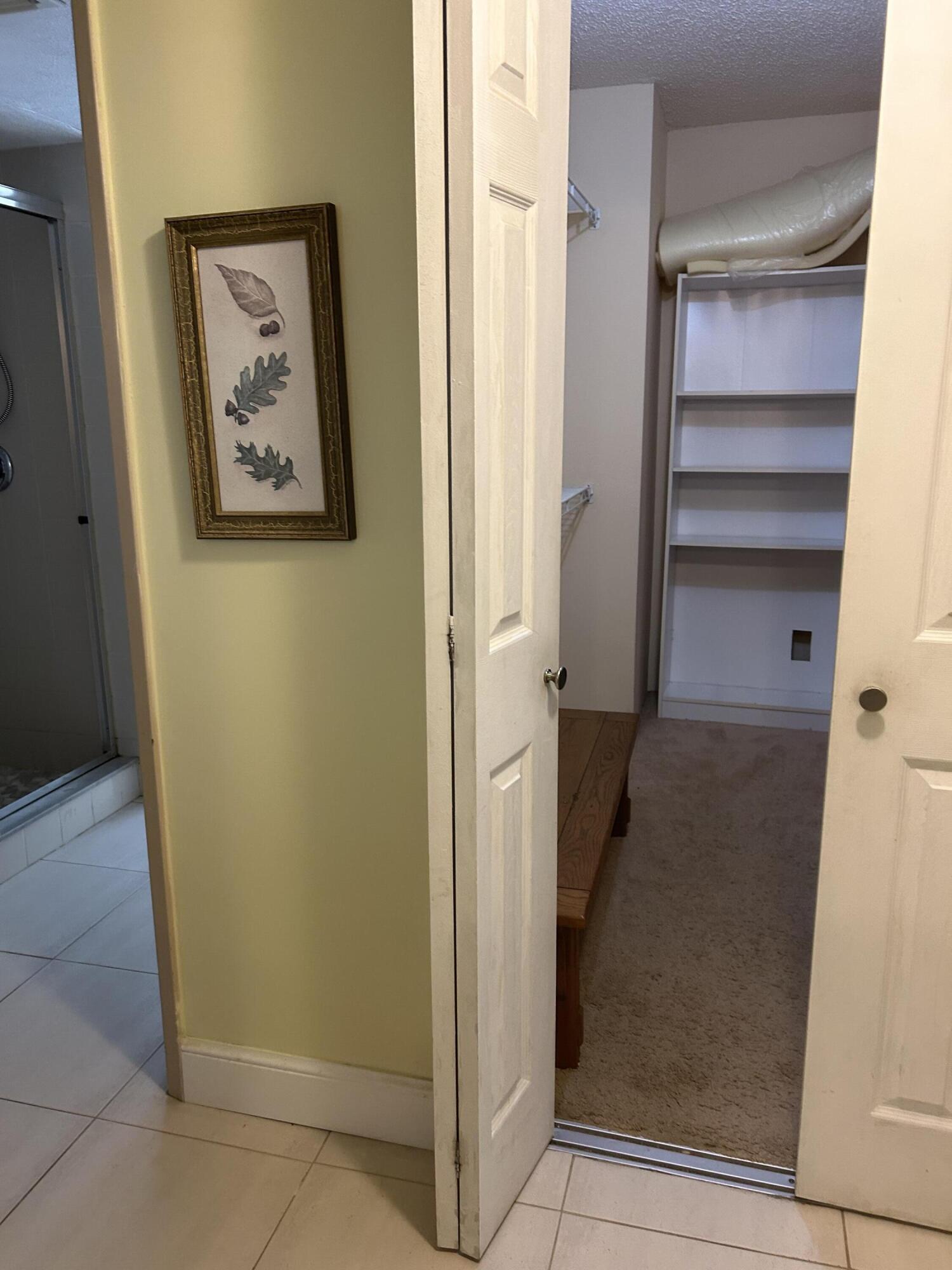 5701 Camino Del Sol, Unit 204 Boca Raton, FL 33433 - Photo 9 of 17 HUGE WALK-IN CLOSET IN MASTER BEDROOM