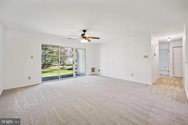 a view of an empty room with a window