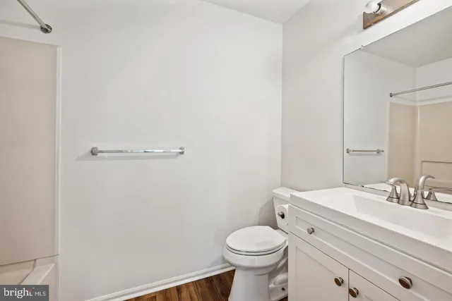 a bathroom with a toilet a sink and shower